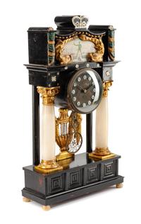 An Austrian Parcel Ebonized Mantel Clock