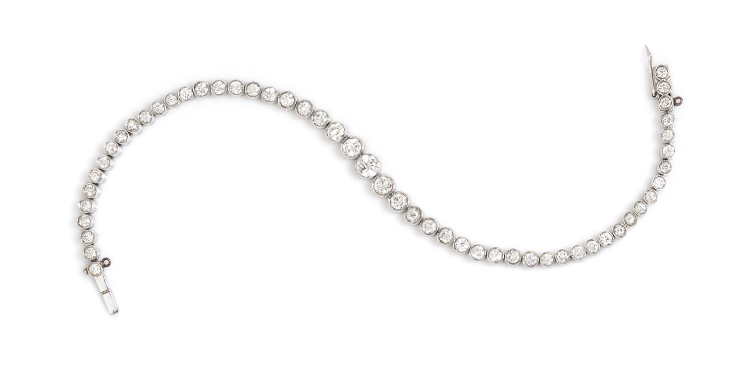 A Platinum and Diamond Graduated Line Bracelet, 9.70 dwts.