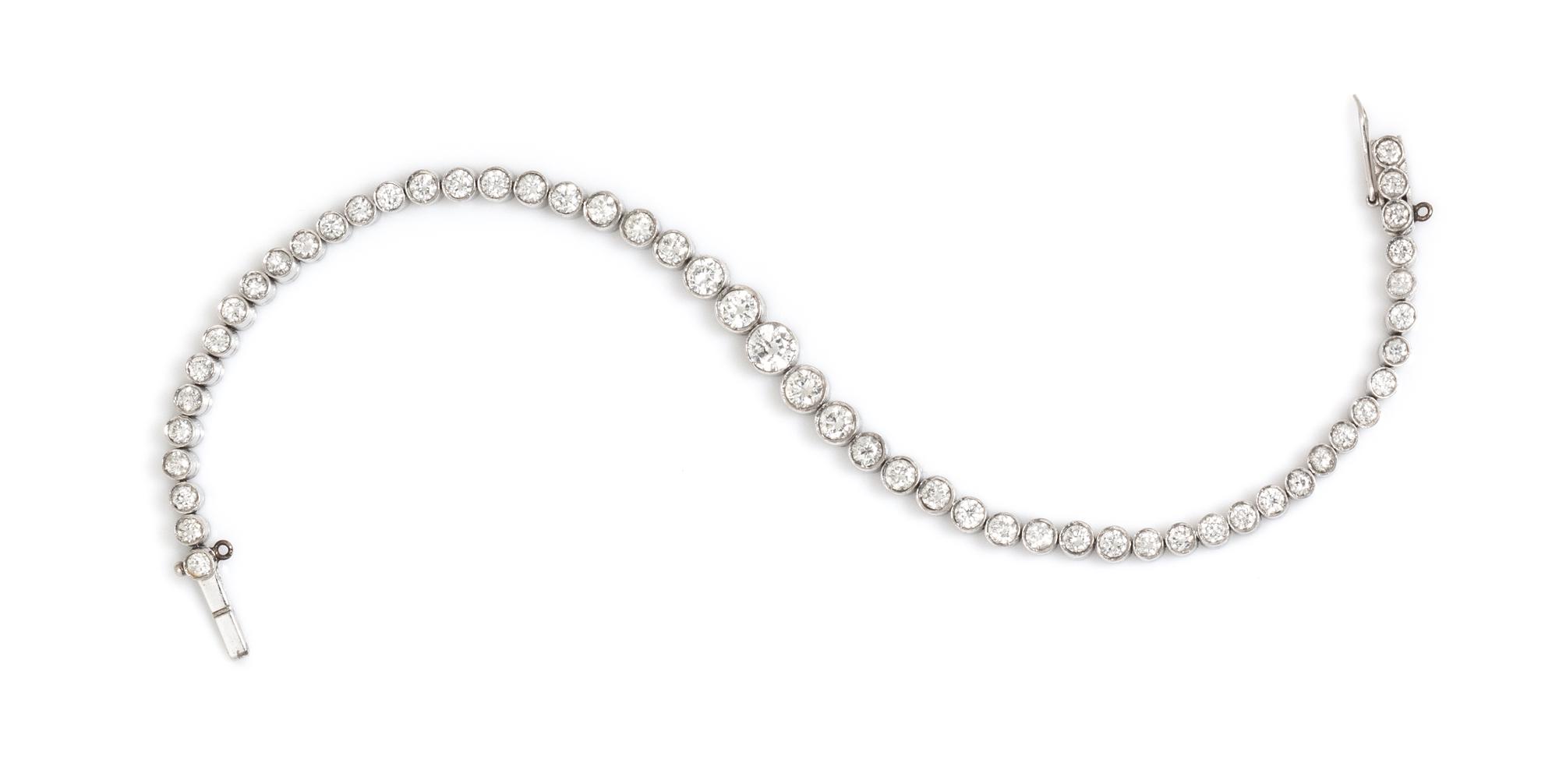 A Platinum and Diamond Graduated Line Bracelet, 9.70 dwts.