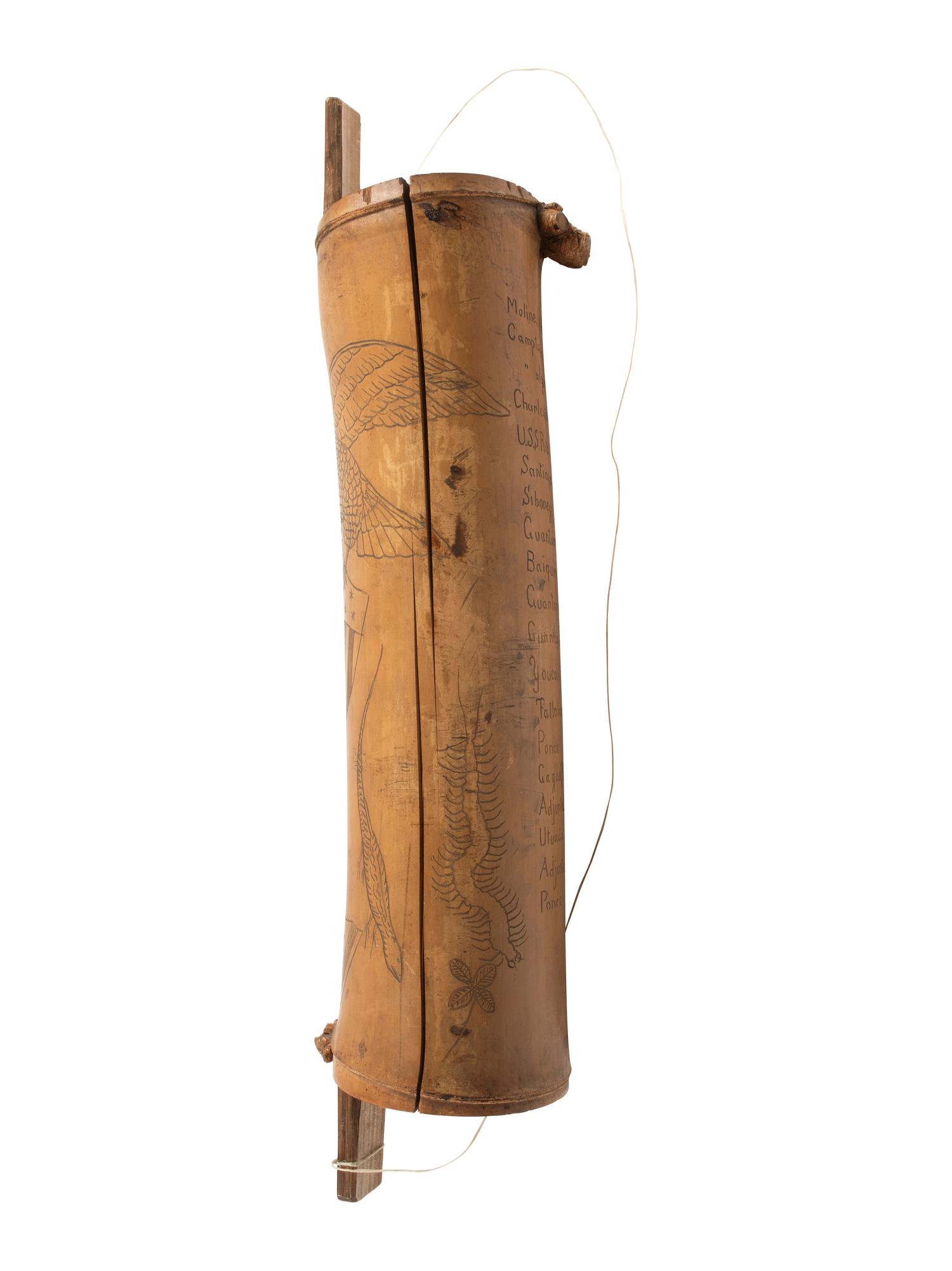 [SPANISH AMERICAN WAR]. Spanish American War-period bamboo canteen with folk art decoration. Ca late 19th century.