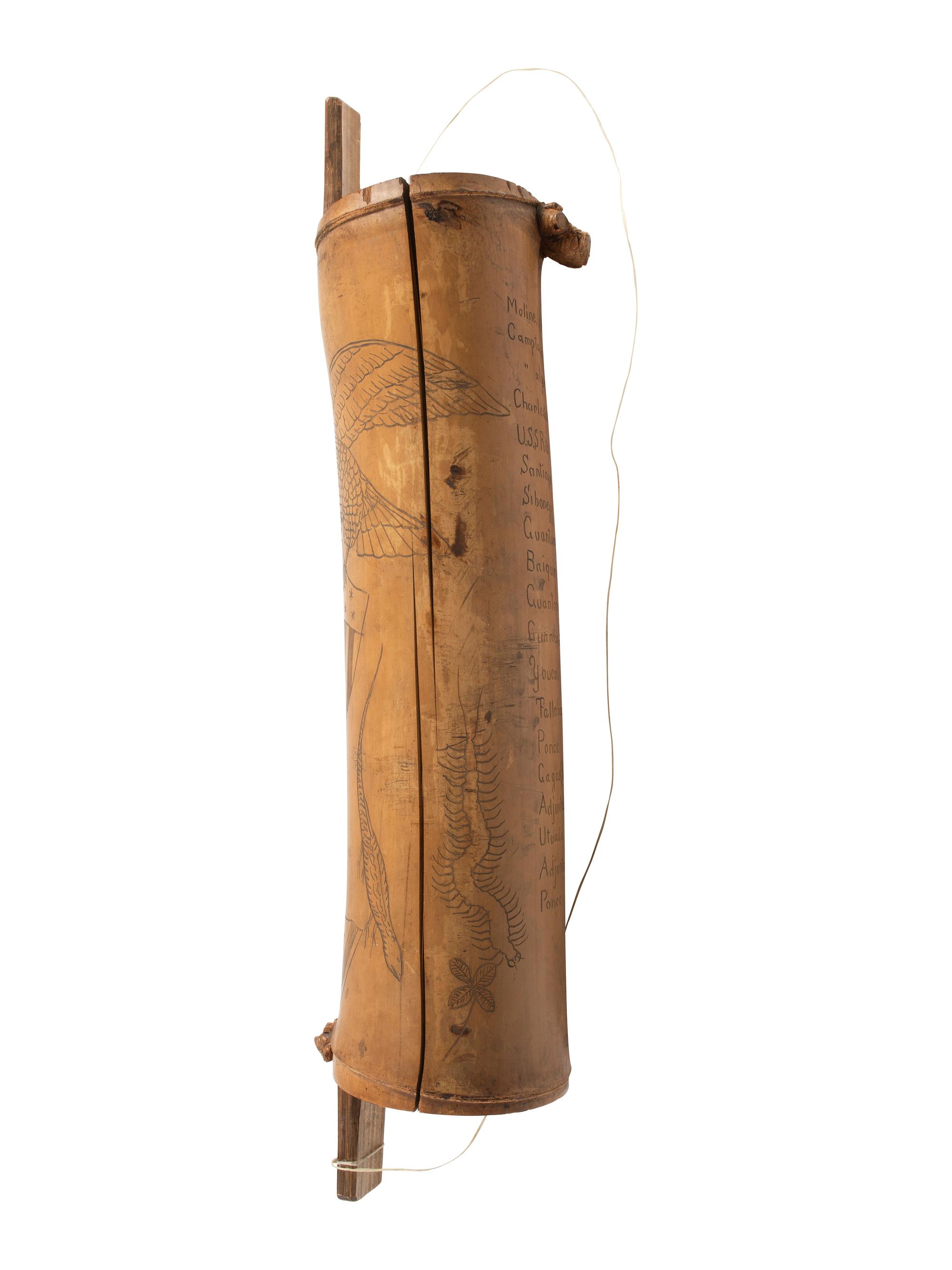 [SPANISH AMERICAN WAR]. Spanish American War-period bamboo canteen with folk art decoration. Ca late 19th century.