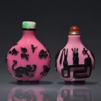Two Chinese Carved Black-Overlaid Pink Glass Snuff Bottles, Qing Dynasty, Circa 1780-1900 — 1780-1900年 粉紅地套黑料鼻煙壺兩支