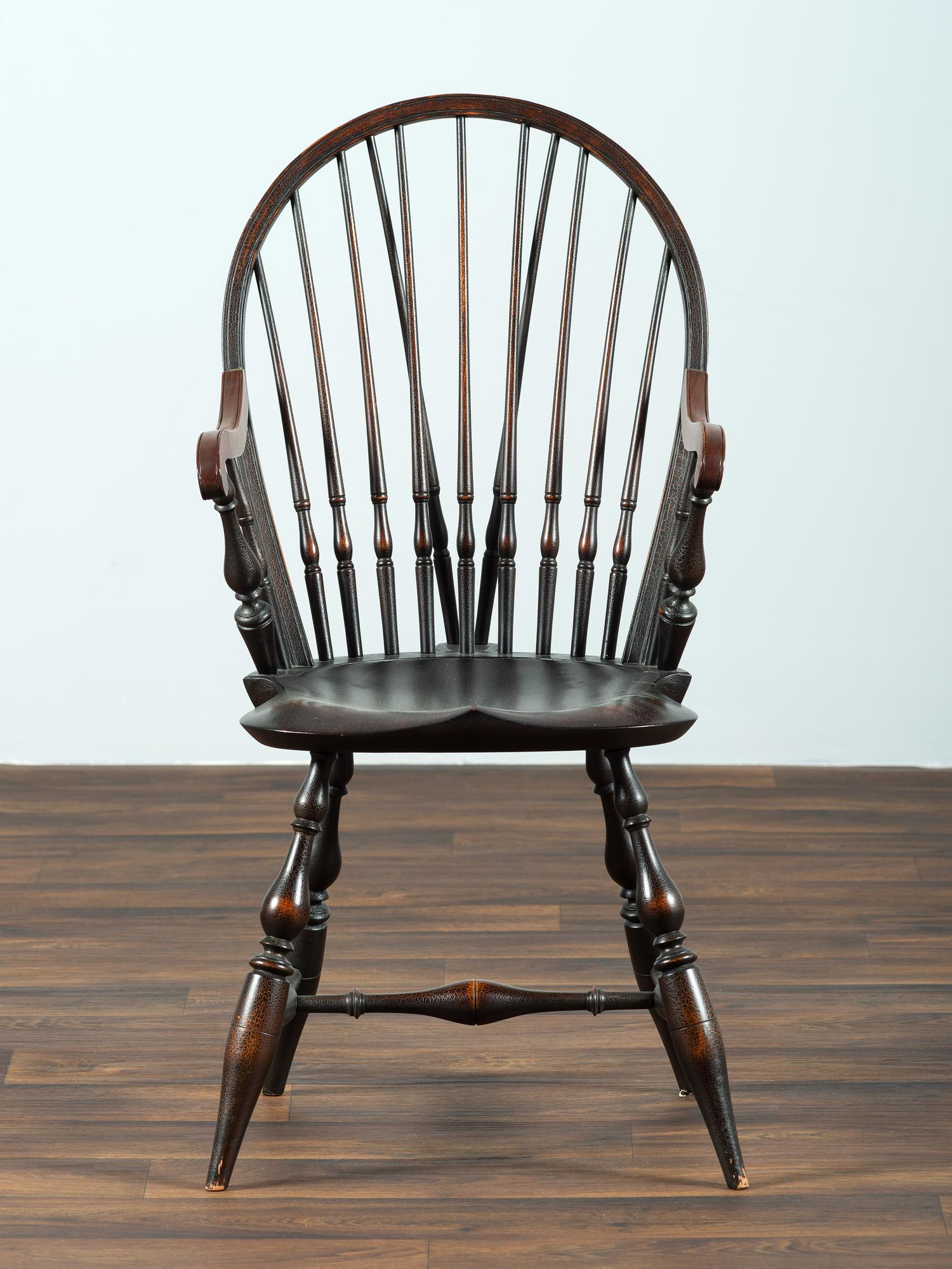 A D.R. Dimes Black-Painted Brace-Back Compass-Seat Windsor Armchair