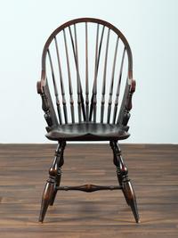 A D.R. Dimes Black-Painted Brace-Back Compass-Seat Windsor Armchair