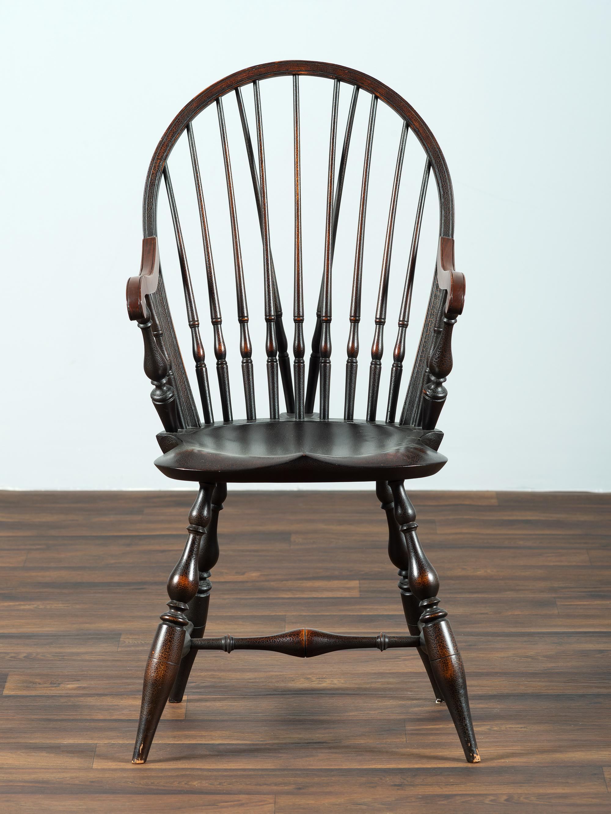A D.R. Dimes Black-Painted Brace-Back Compass-Seat Windsor Armchair