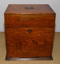 An American Oak Decanter Case Height 14 1/8 x width 13 1/4 x depth 10 inches.