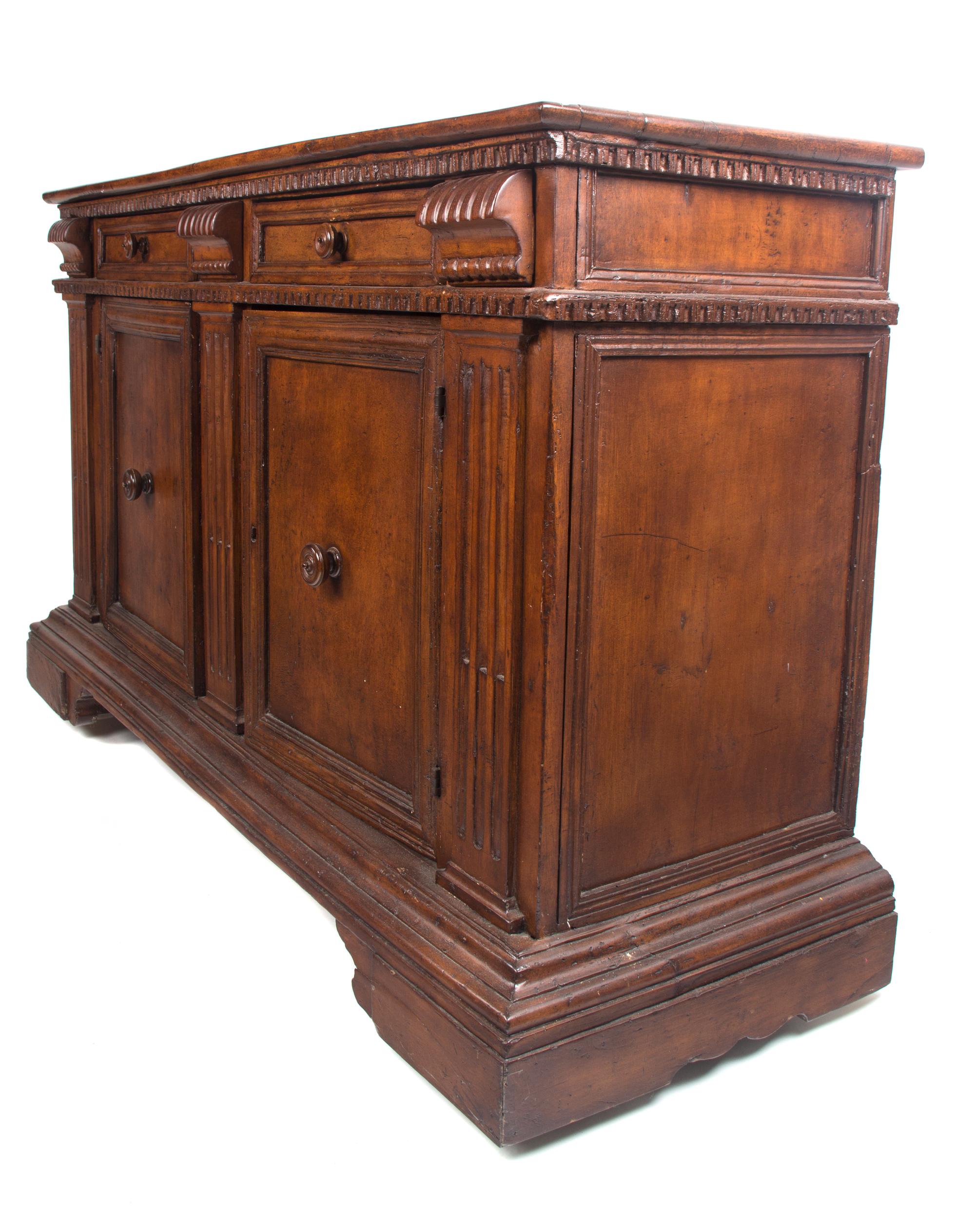 An Italian Walnut Server Height 40 1/2 x width 66 1/2 x depth 21 1/2 inches.