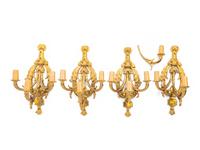 A Set of Four Louis XVI Style Gilt Metal Three-Light Sconces
