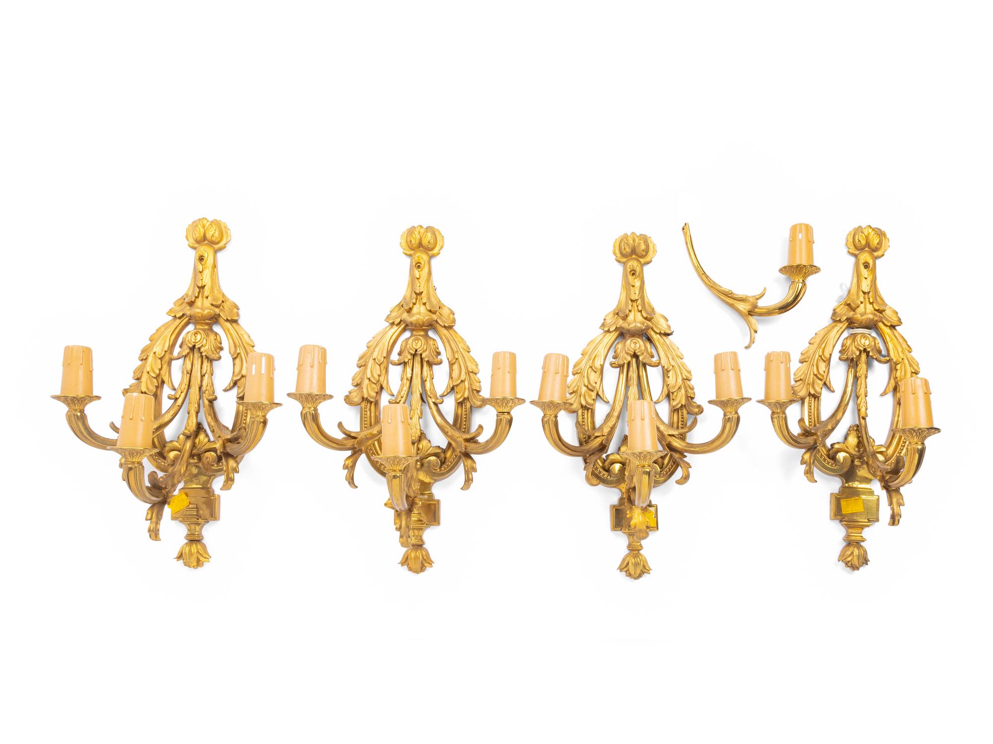 A Set of Four Louis XVI Style Gilt Metal Three-Light Sconces