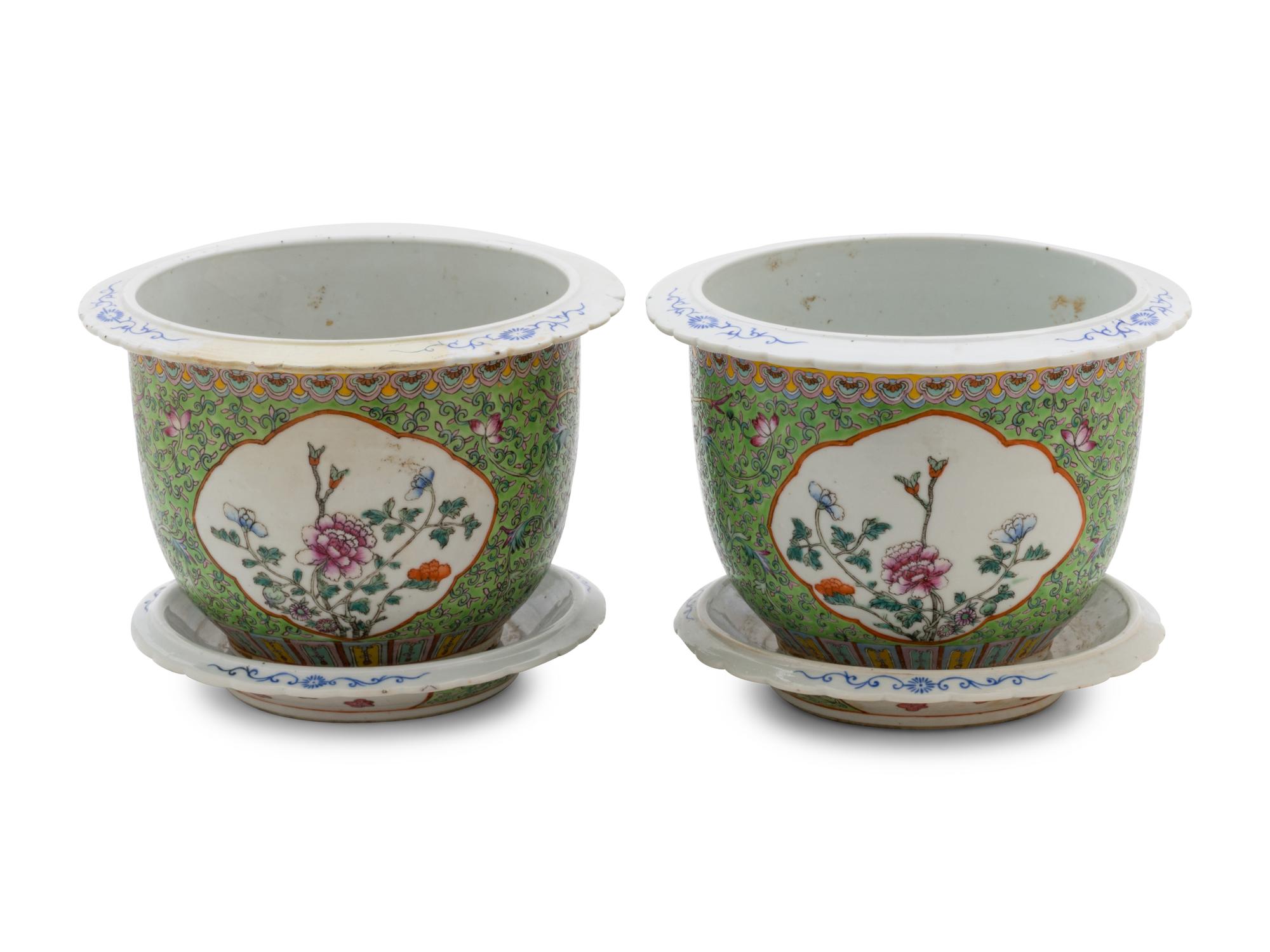 A Pair of Apple Green Ground Famille Rose Flower Pots and Stands