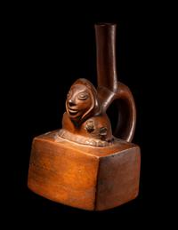 A Chimu-Inca Redware Stirrup Vessel with Squared Body and Human Figure