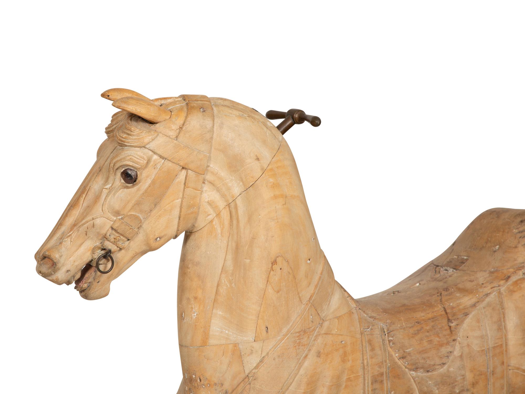 A Pair of Italian Carved Wood Carousel Horses in the Manner of Gustav Dentzel