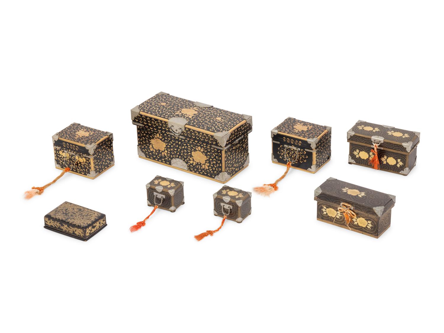 Eight Japanese Gilt and Black Lacquered Boxes