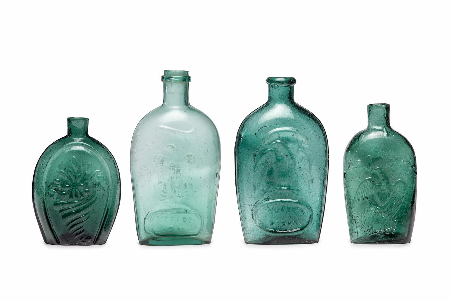 Four Molded Glass Green Flasks