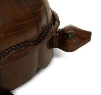A Carved Wood and Leather Turtle Foot Stool — LATE 20TH CENTURY
