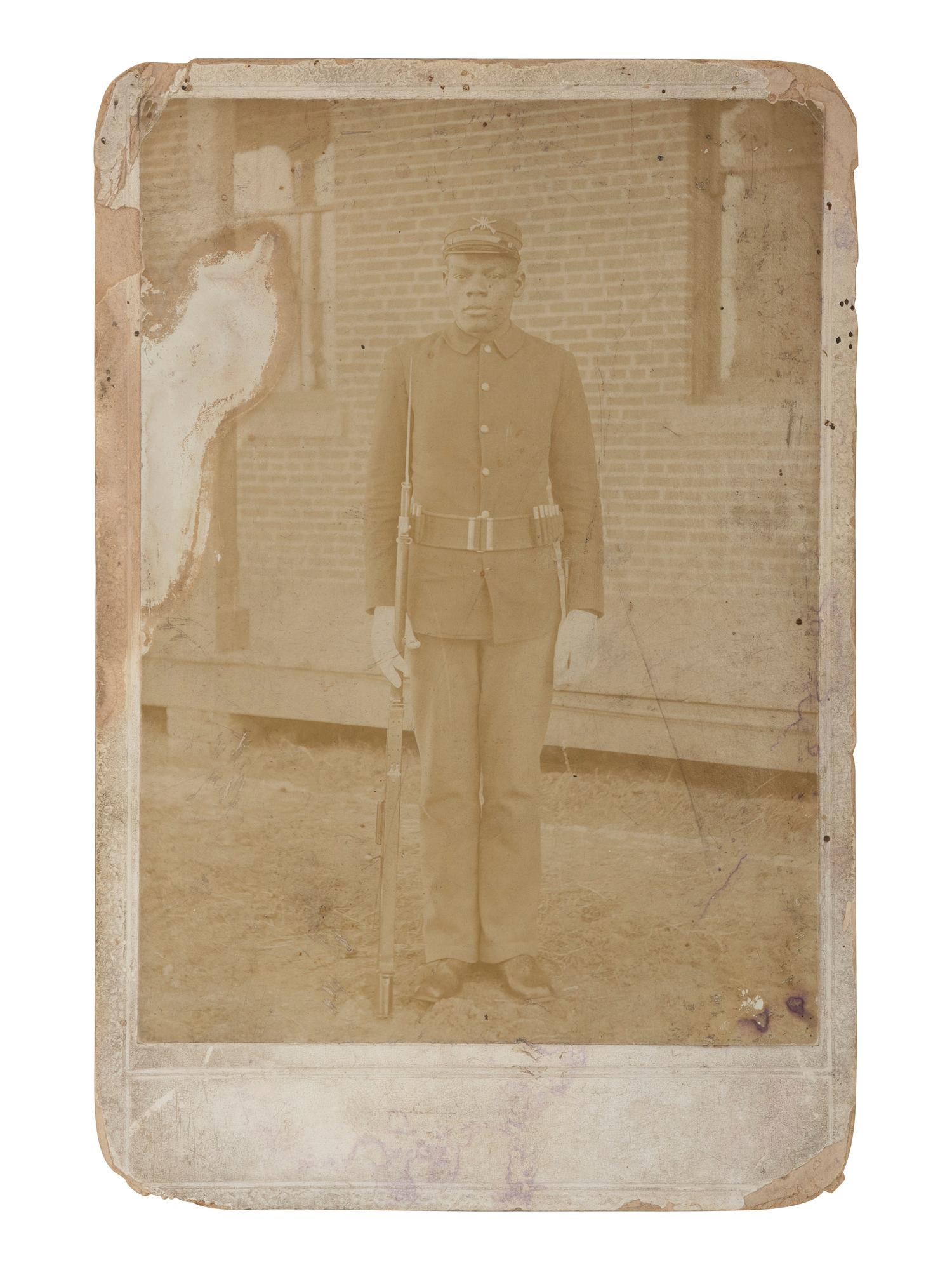 [LATE INDIAN WARS]. Cabinet card of Isaac Brown, likely 24th US Infantry, taken while at Fort Logan, February 1899.