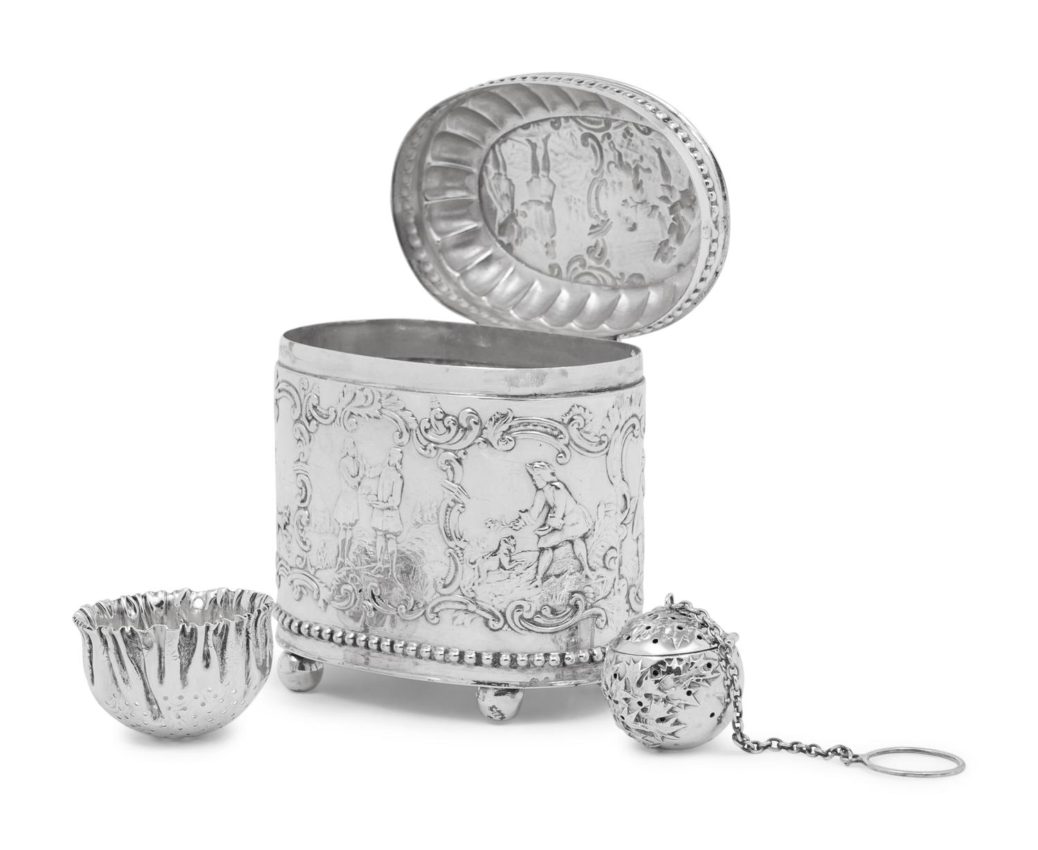 A Continental Silver Tea Caddy, Strainer and Tea Ball