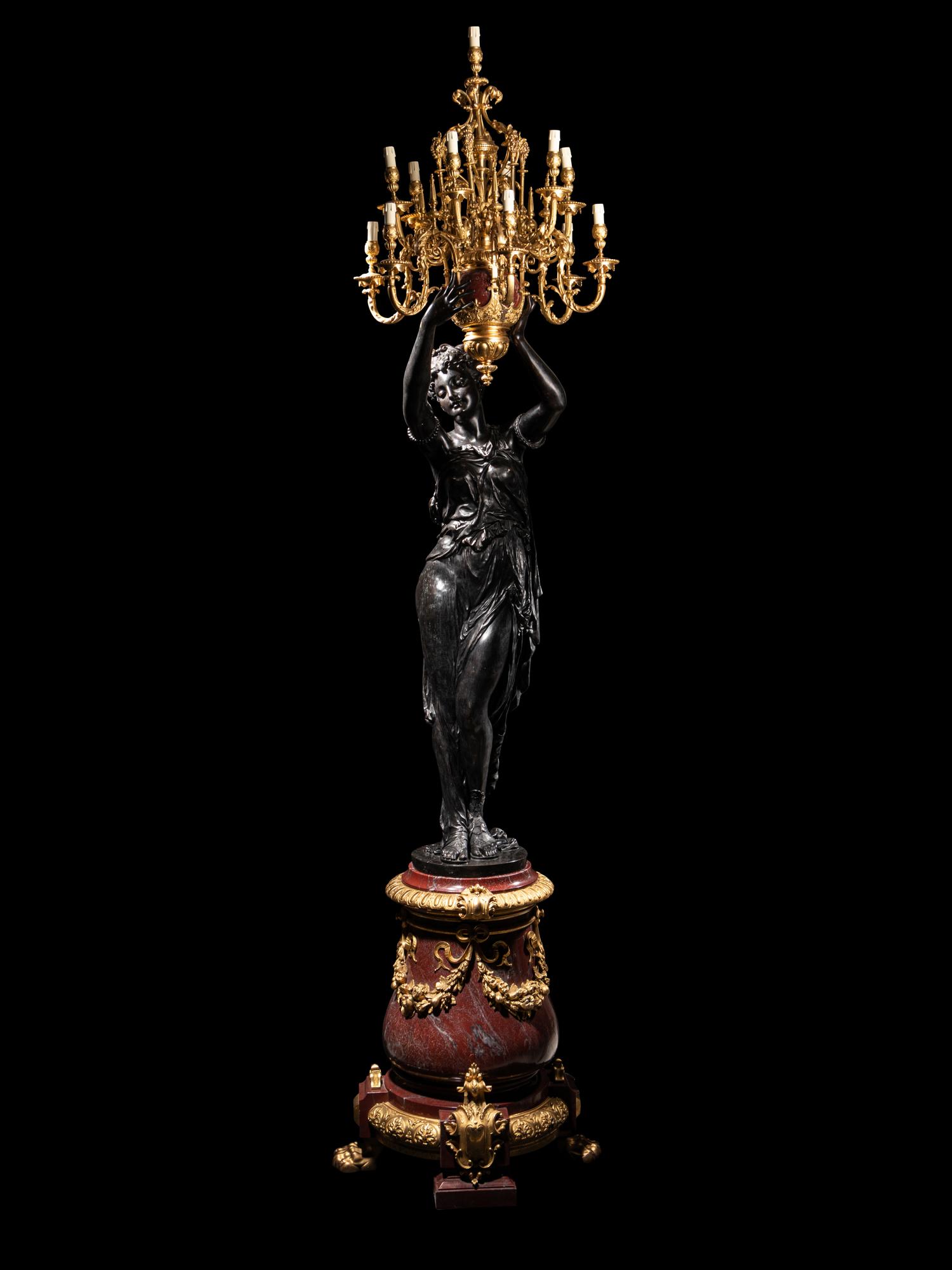 A Pair of Monumental Gilt and Patinated Bronze and Rouge Marble Figural Torchères