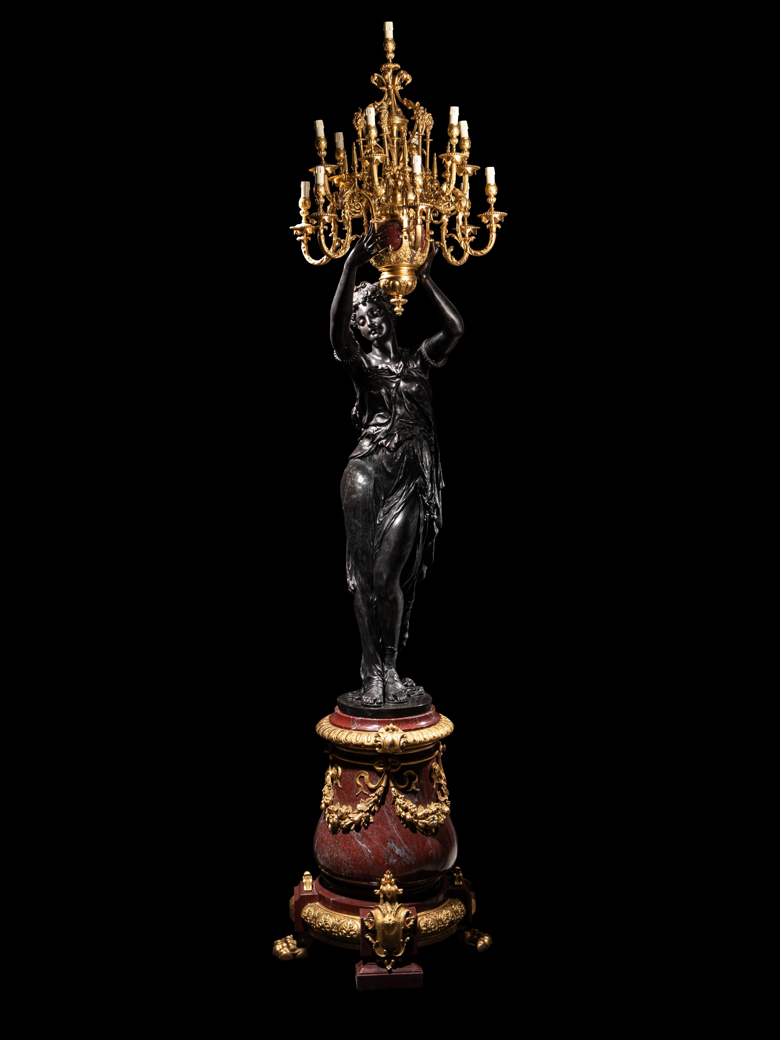 A Pair of Monumental Gilt and Patinated Bronze and Rouge Marble Figural Torchères