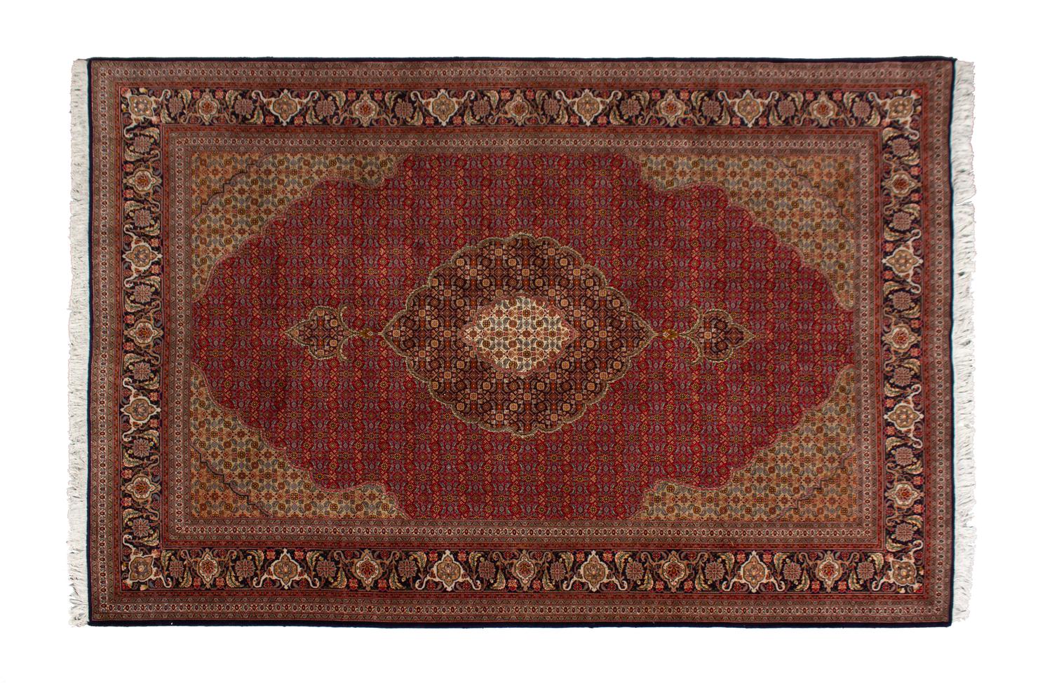 A Tabriz Wool Rug — 20TH CENTURY