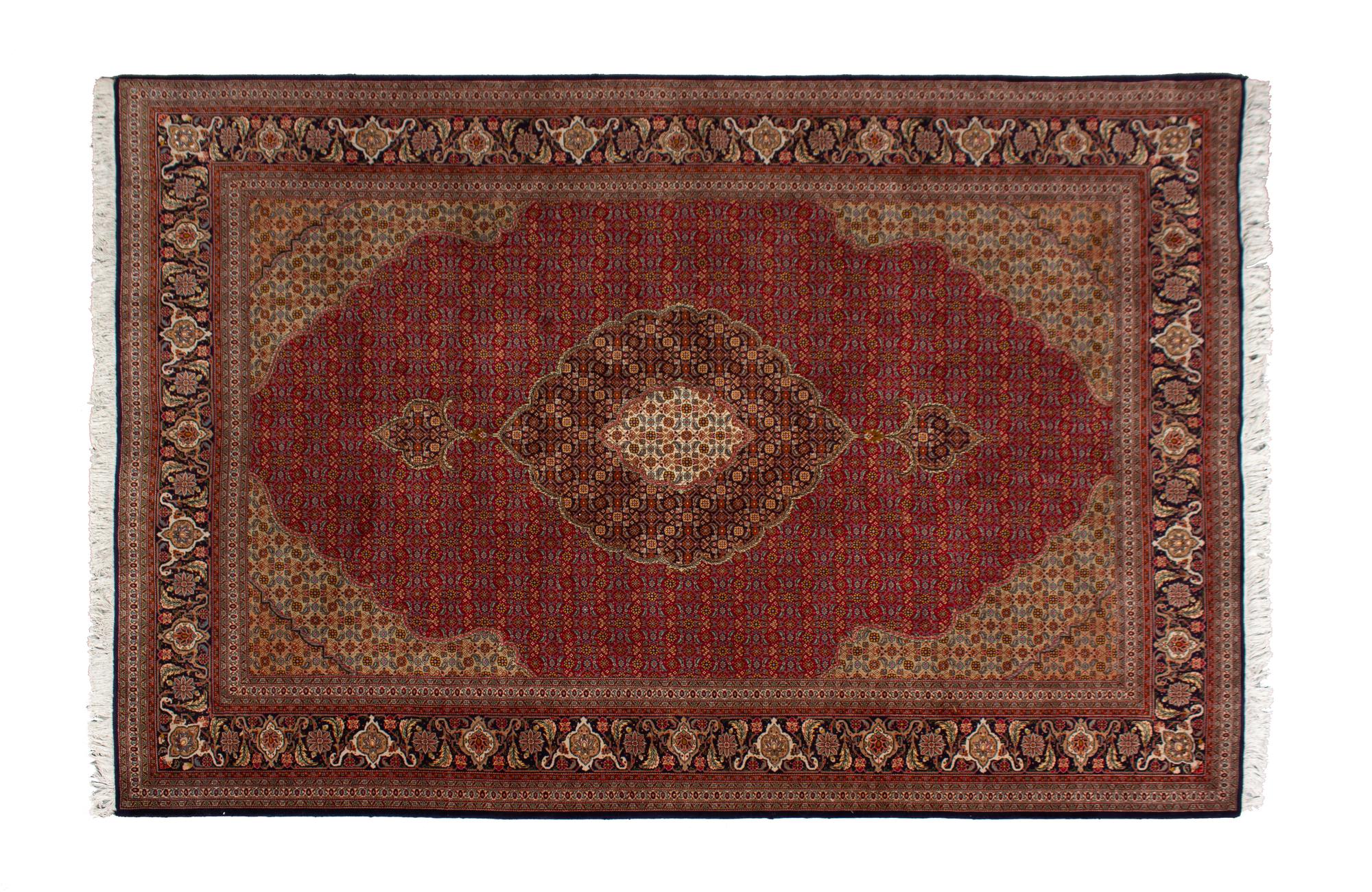 A Tabriz Wool Rug — 20TH CENTURY