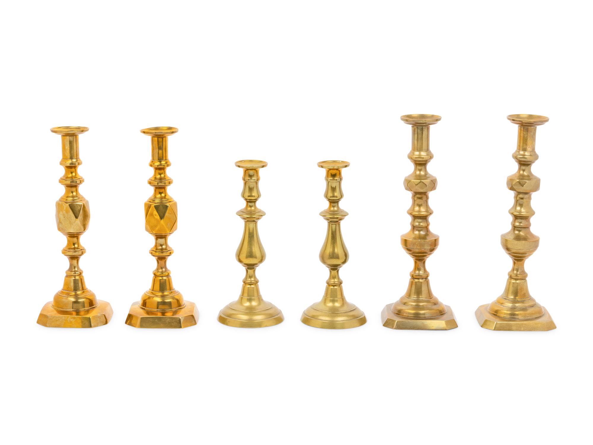 Three Pairs of English Brass Candlesticks
