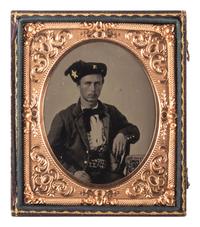 [CIVIL WAR]. Sixth plate tintype of a young soldier, possibly from New York, with a large star and "E" insignia on his cap.