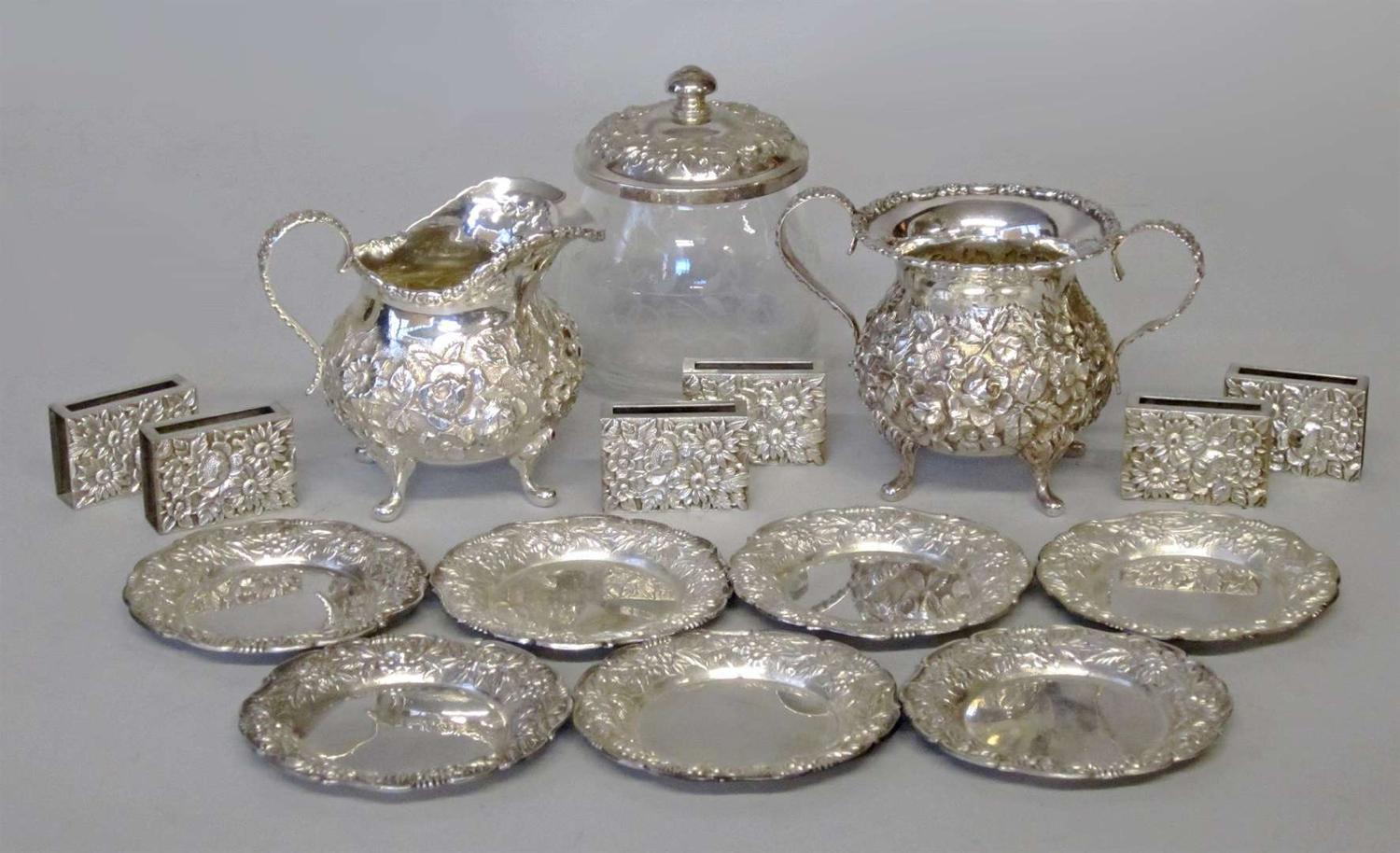 Group of sterling silver repoussé matchbooks and ashtrays s. kirk & son, baltimore, md, 20th century