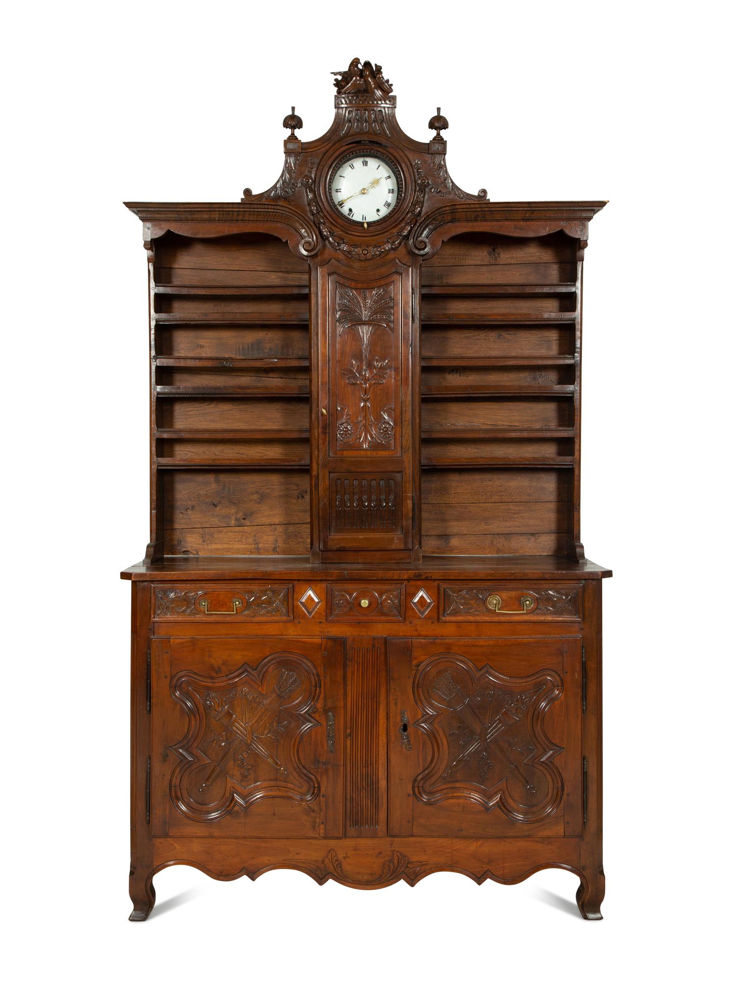 A French Provincial Carved Walnut Clock-Inset Vaissellier