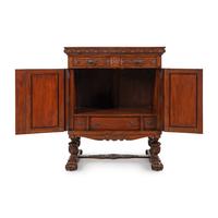 A Baroque Style Carved Walnut and Steel Mounted Cabinet