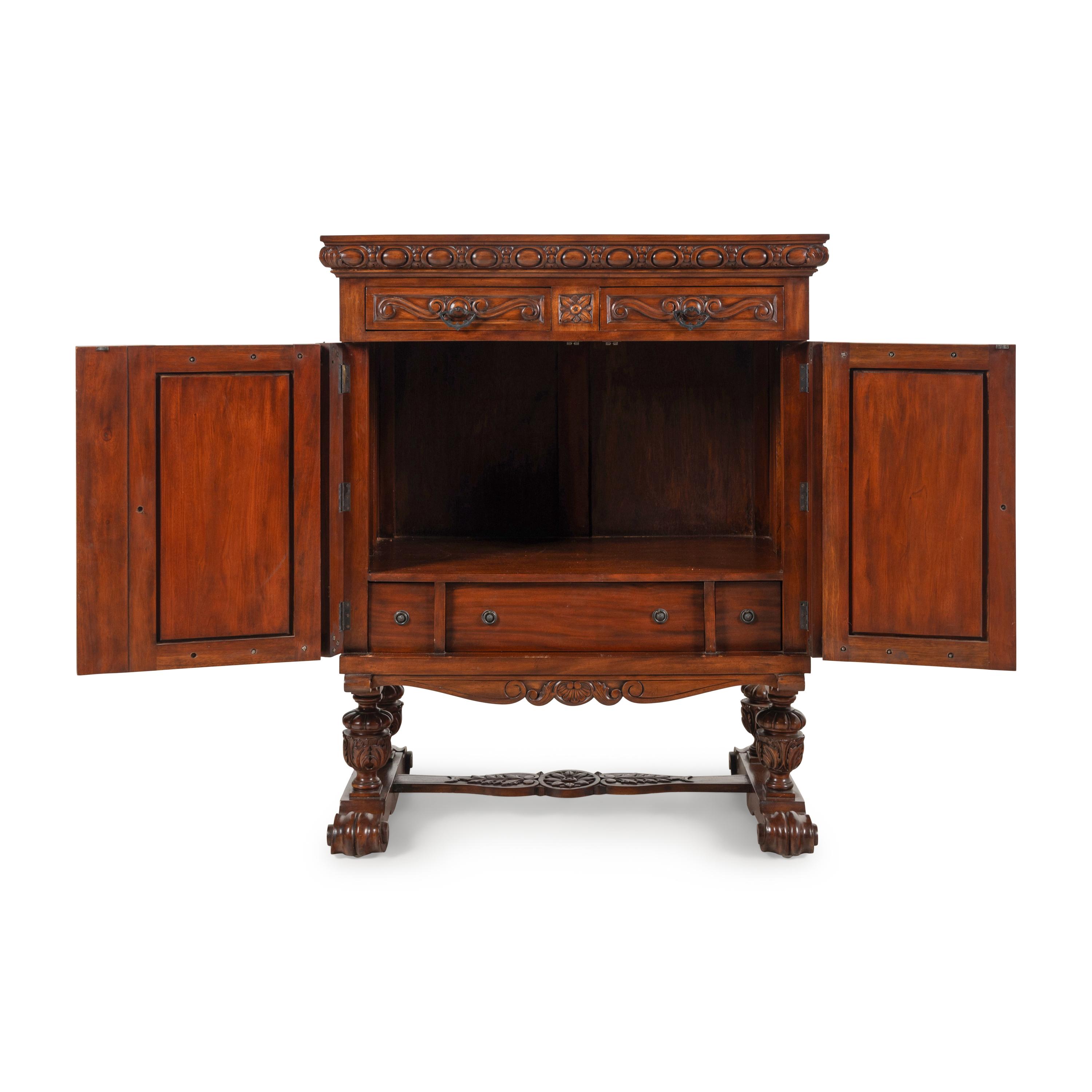 A Baroque Style Carved Walnut and Steel Mounted Cabinet