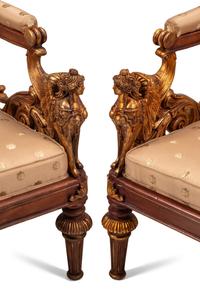 A Pair of Empire Style Parcel Gilt Walnut Armchairs