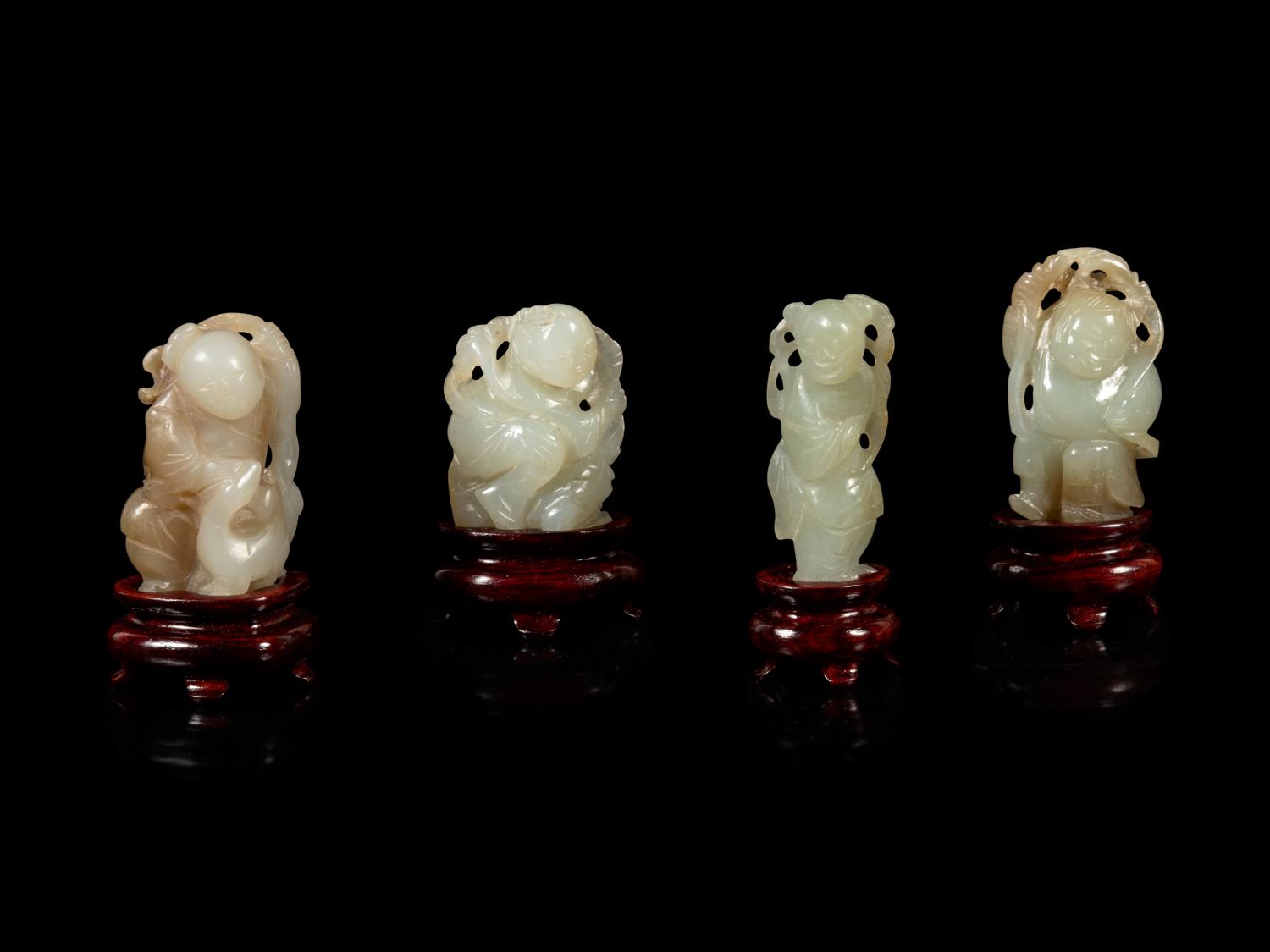Eight Chinese Celadon Jade Figures of Boys
