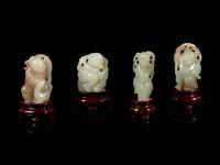 Eight Chinese Celadon Jade Figures of Boys