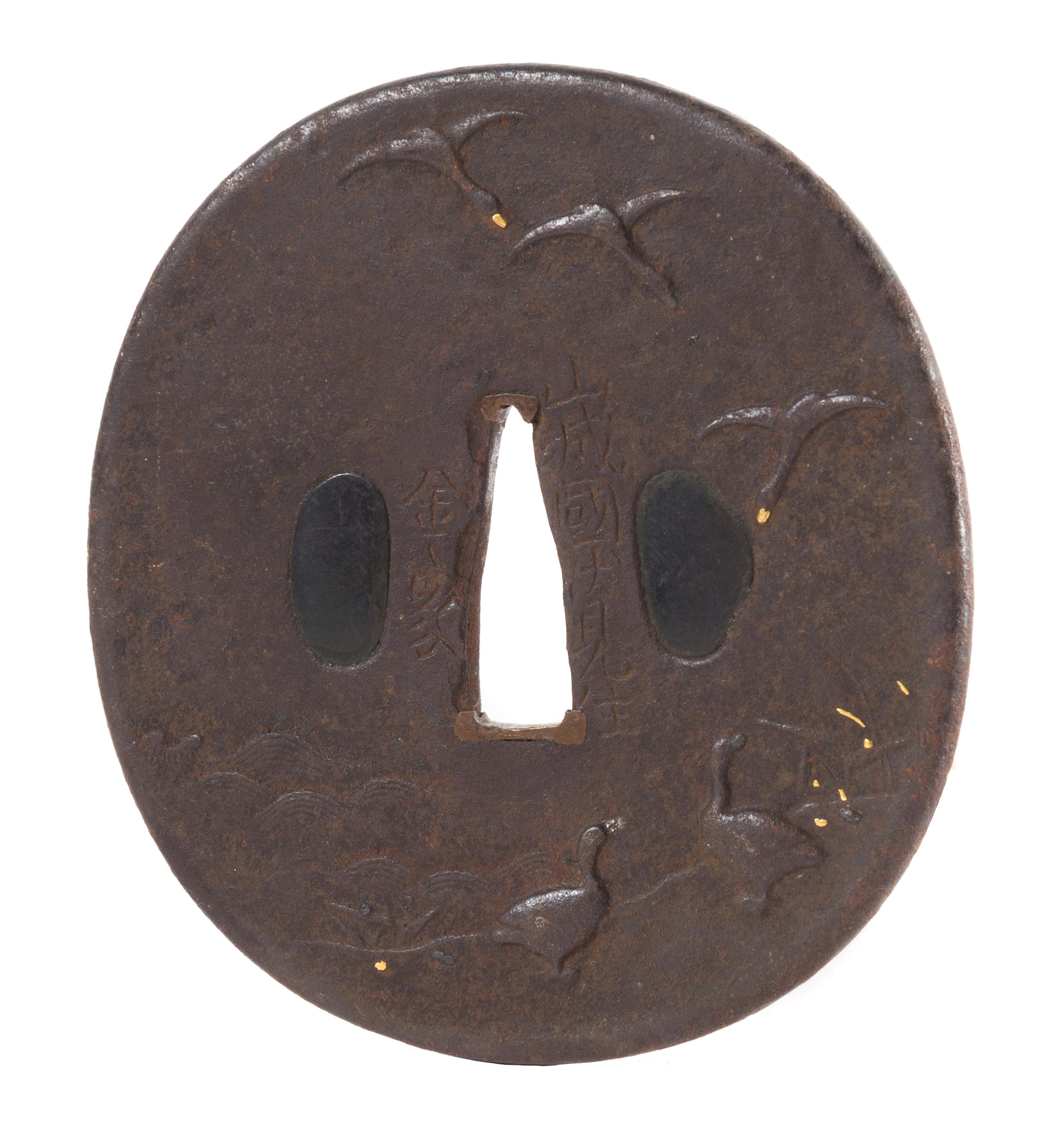 An Iron Tsuba Height 3 1/4 inches.