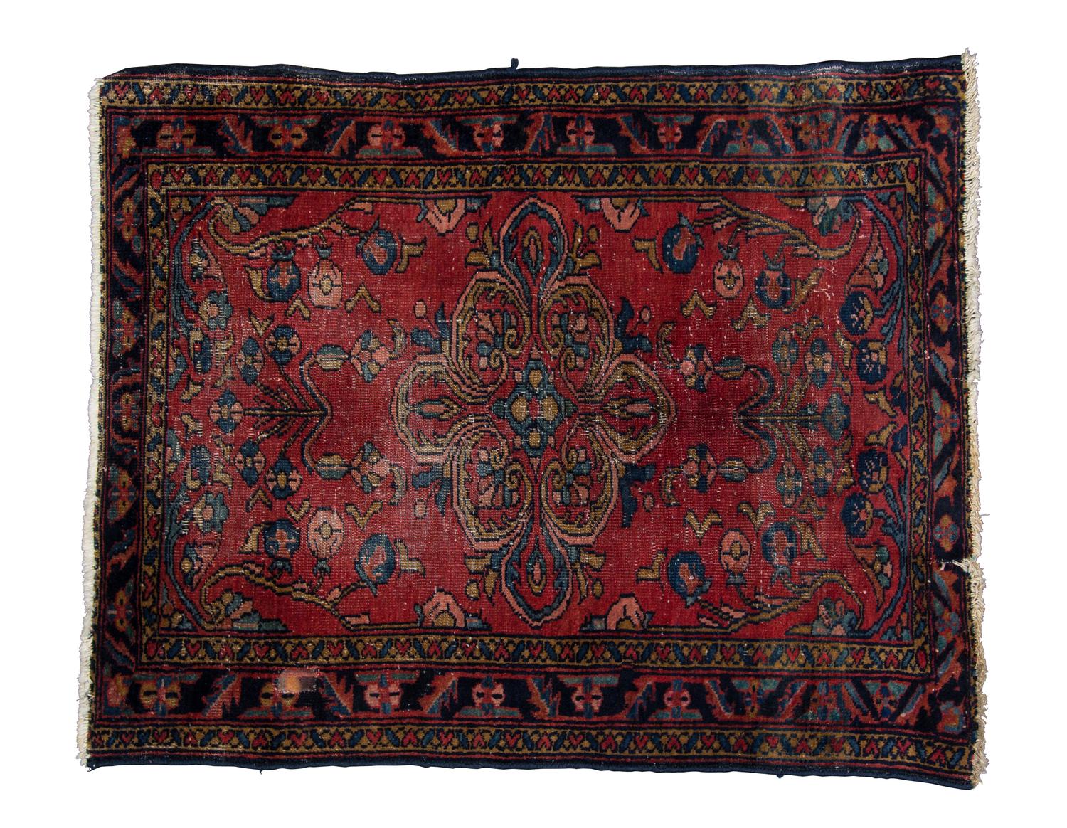 A Persian Wool Rug 2 feet 7 inches x 3 feet 3 inches.