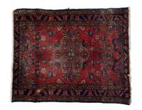 A Persian Wool Rug 2 feet 7 inches x 3 feet 3 inches.