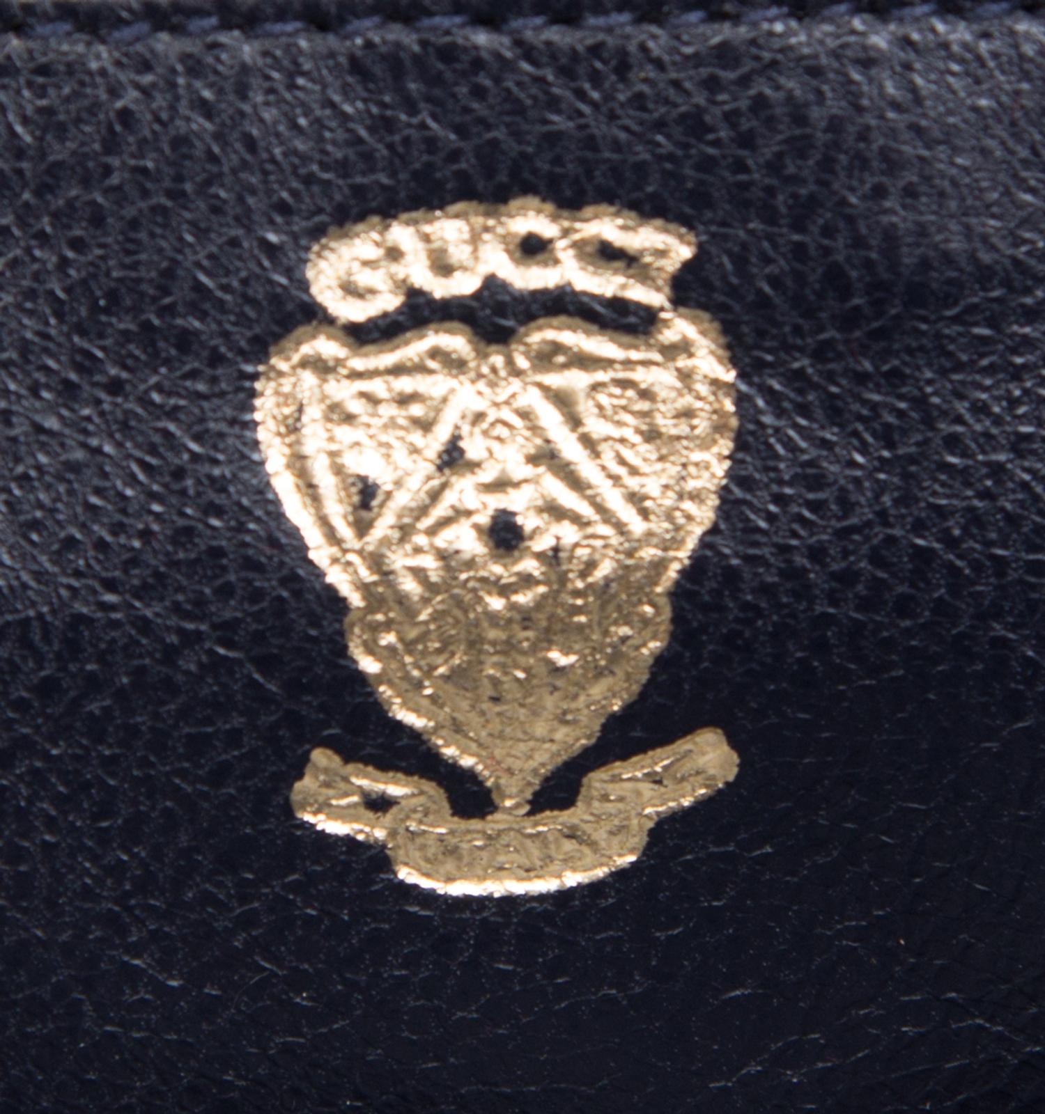 A Gucci Purple Suede Handbag, 9.5" x 7" x 2.5".
