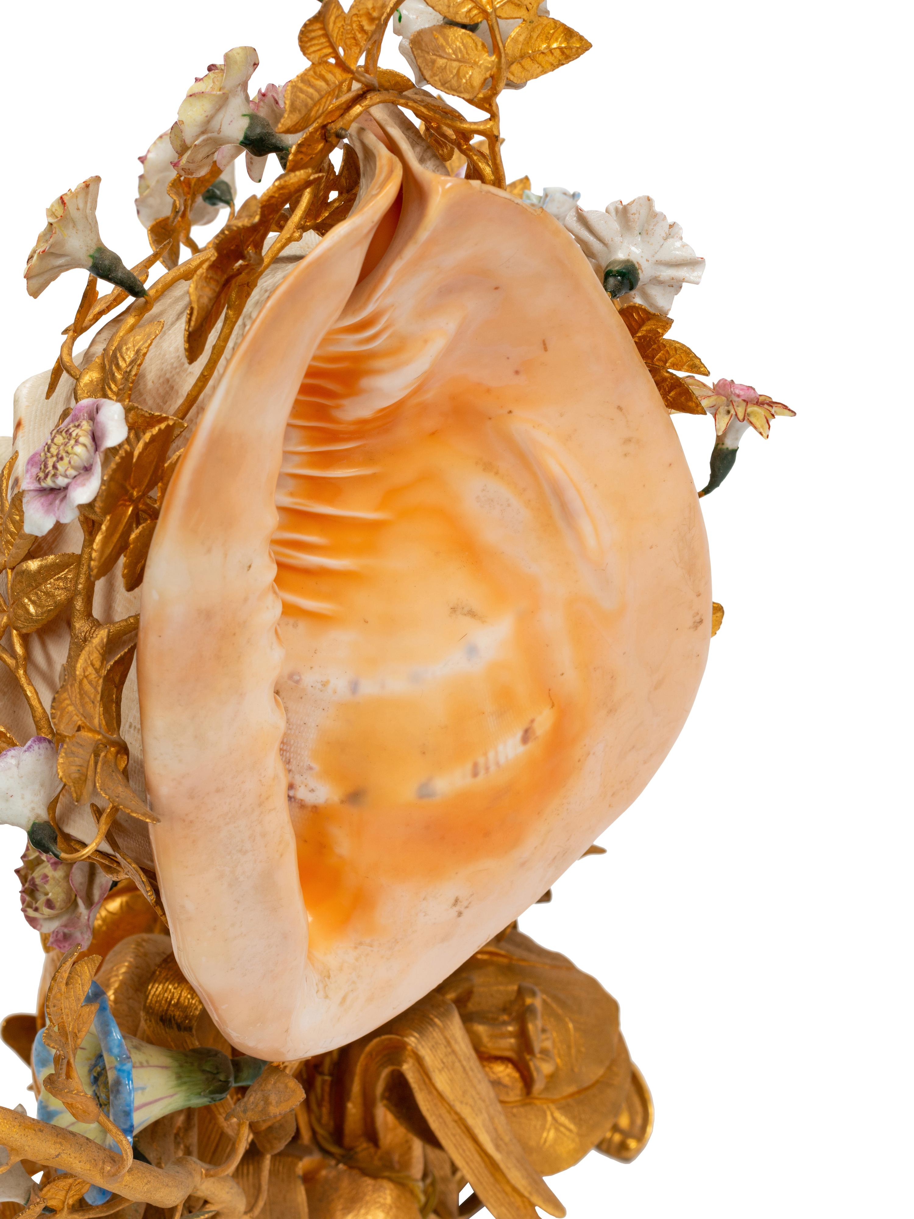A Louis XV Style Gilt Bronze, Porcelain and Seashell Mounted Sea Motif Lamp