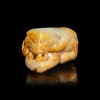 A Chinese White and Russet Jade Mythical Beast, Bixie, Ming Dynasty (1368-1644) 明 白玉辟邪
