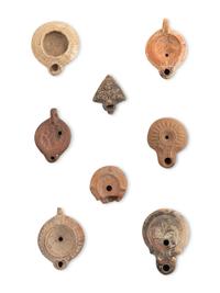 A Group of Seventeen Roman Oil Lamps and Lamp Handles
