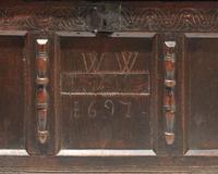 A William & Mary carved oak coffer, dated "1697"