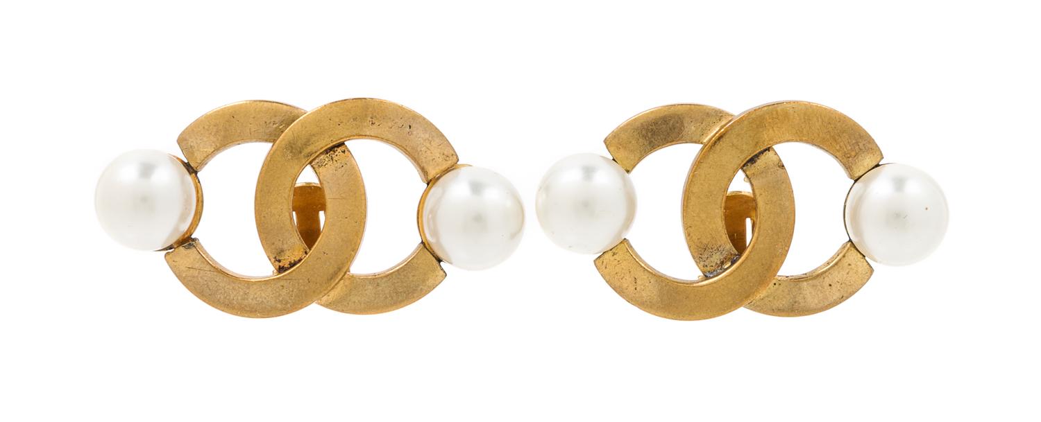A Pair of Chanel Goldtone Logo Earclips, 2" x 1".