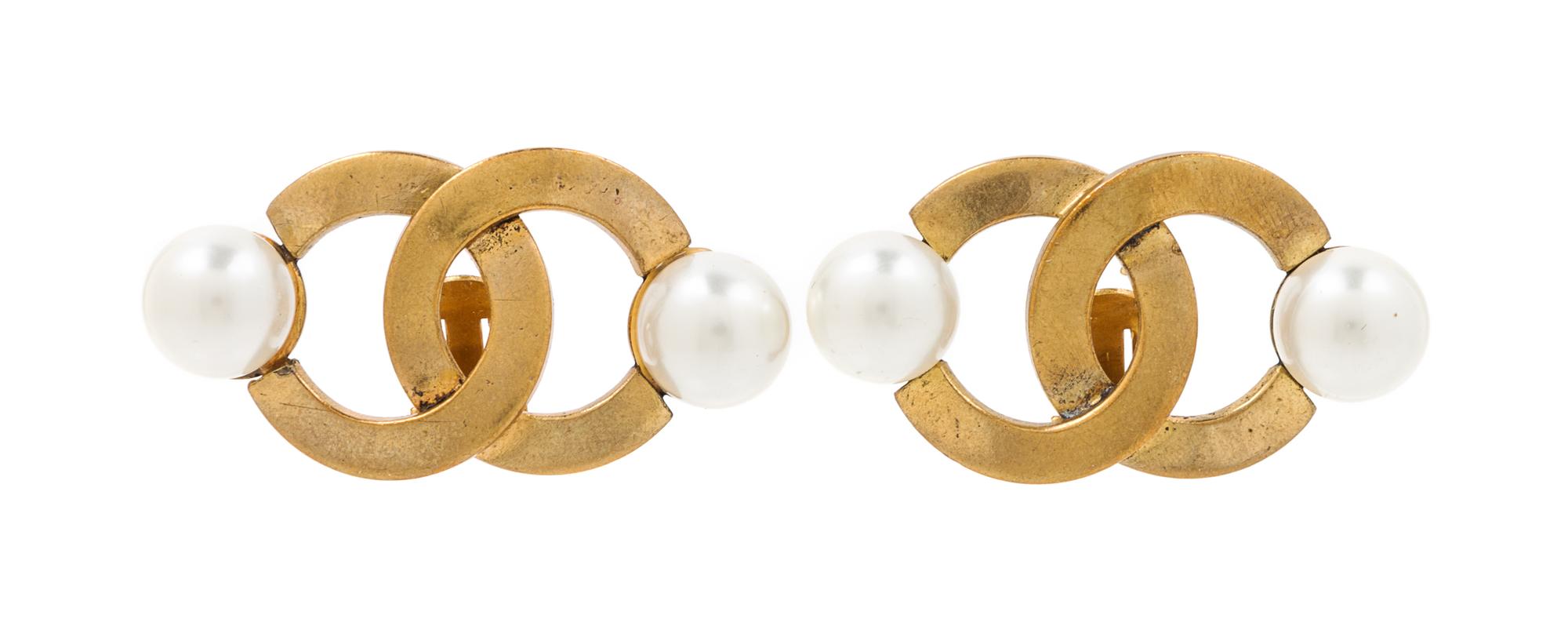 A Pair of Chanel Goldtone Logo Earclips, 2" x 1".