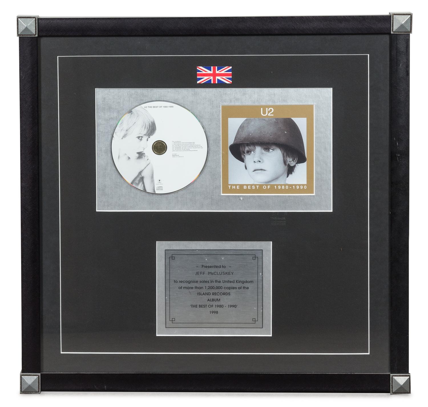 A U2: The Best of 1980-1990 1.2 Million UK Copies Sold Presentation Album 18 3/4 x 18 3/4 inches.