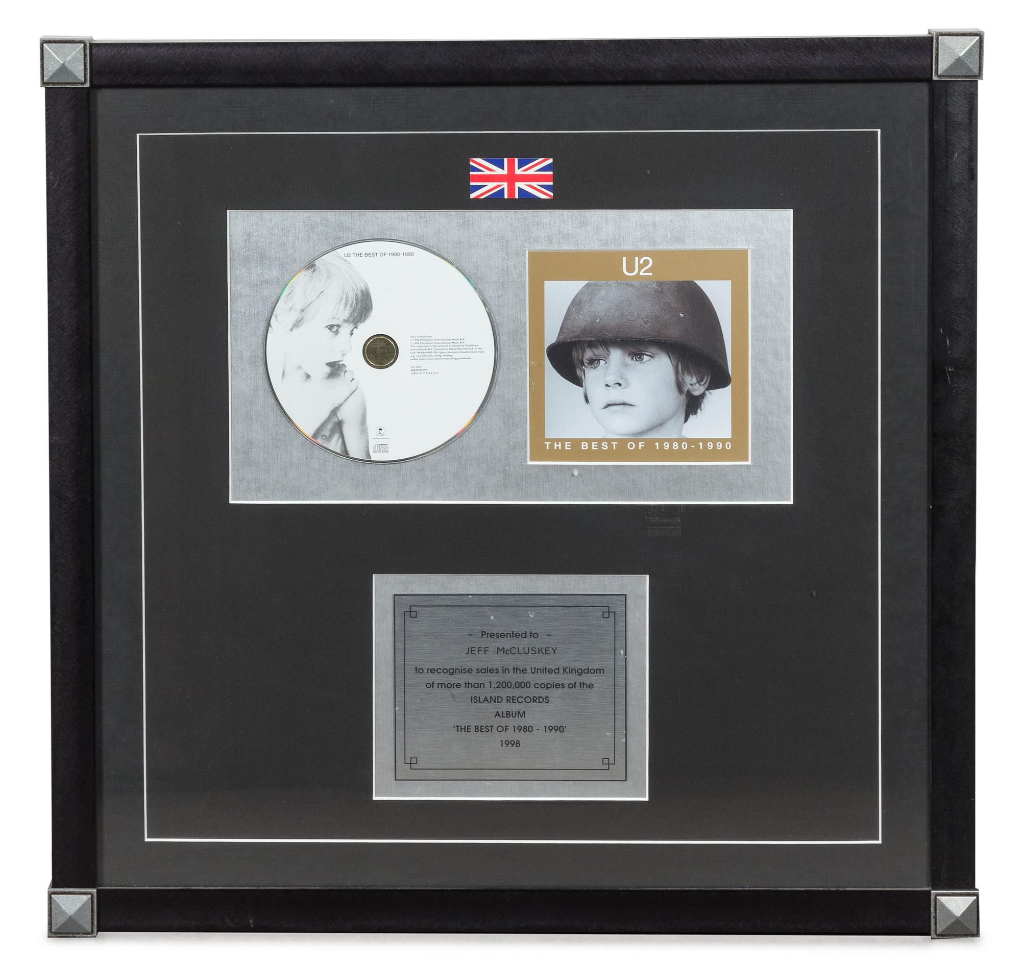 A U2: The Best of 1980-1990 1.2 Million UK Copies Sold Presentation Album 18 3/4 x 18 3/4 inches.