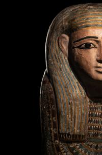 An Egyptian Polychrome Wood Mummy Mask