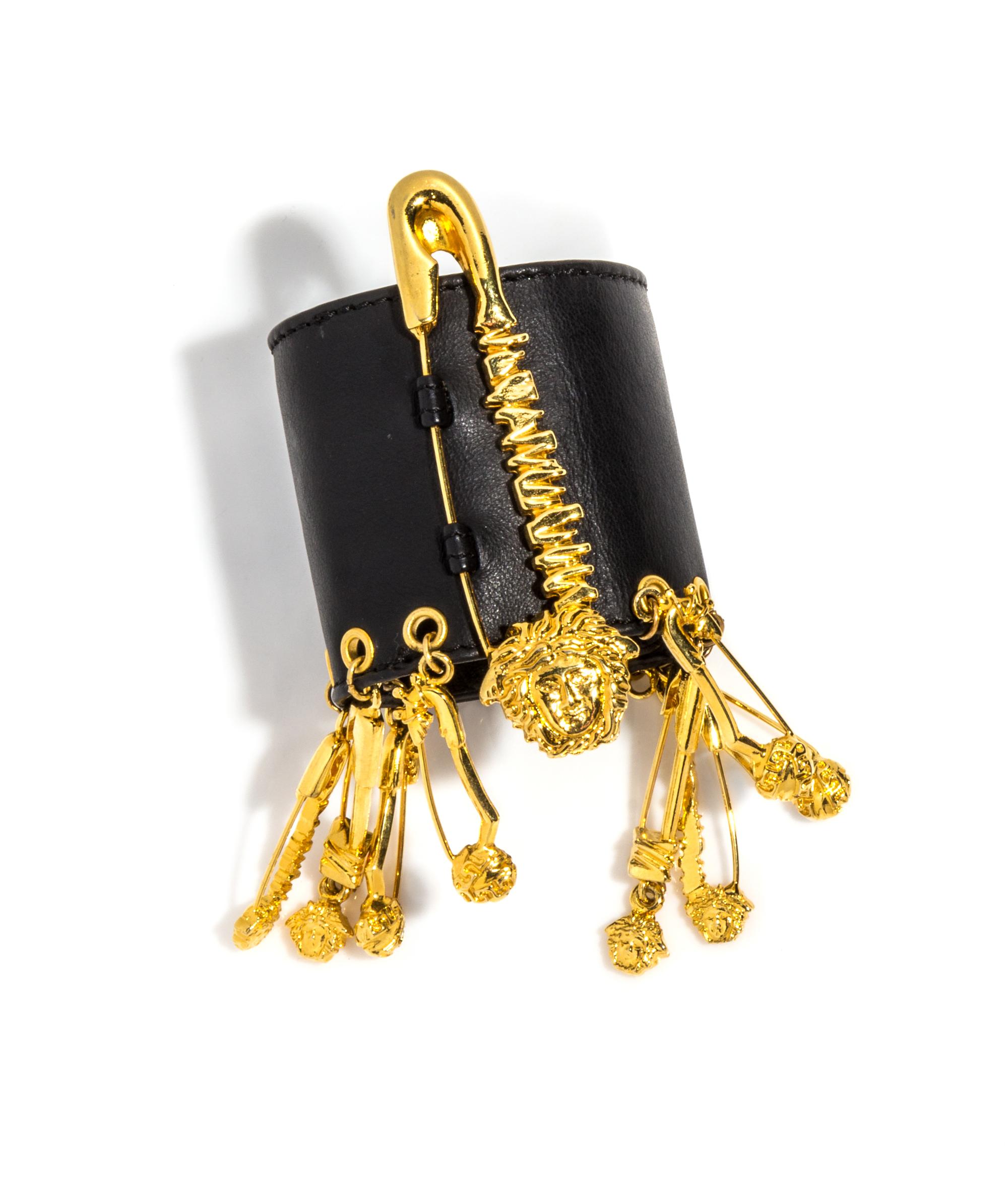 A Versace Black Leather Safety Pin Bracelet, 6.5"- 7.5" x 2.5".