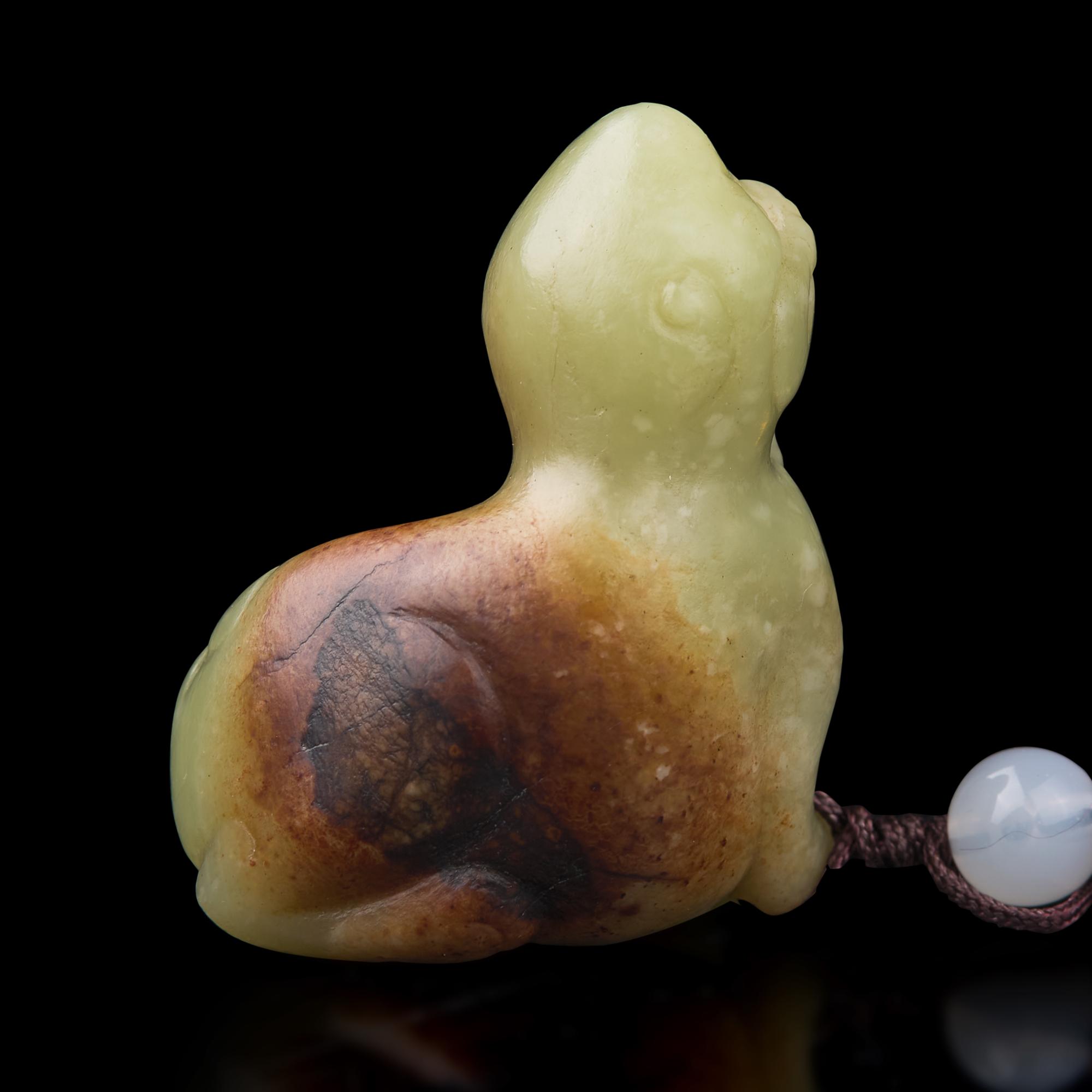 A Chinese Russet and Yellow Jade Figure of a Mythical Beast 青黃玉瑞獸