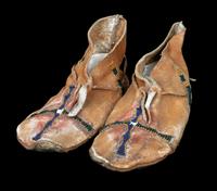 A Pair of Beaded Jicarilla Apache Moccasins Length 7 inches.